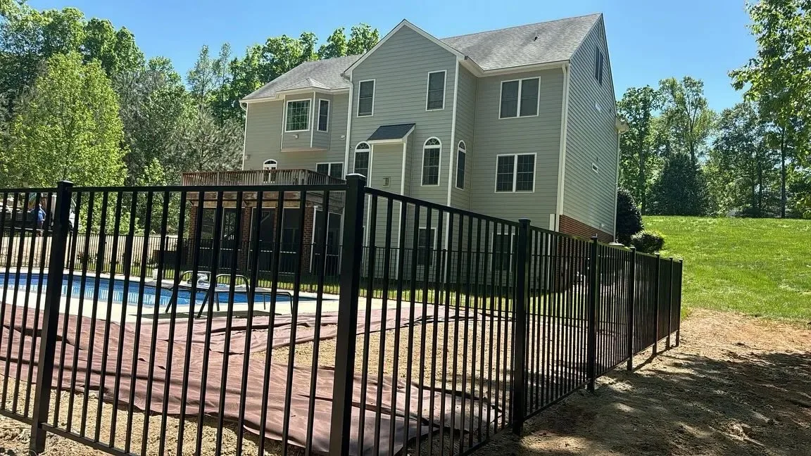 Black aluminum pool fence installed by Chesterfield Fencing & More